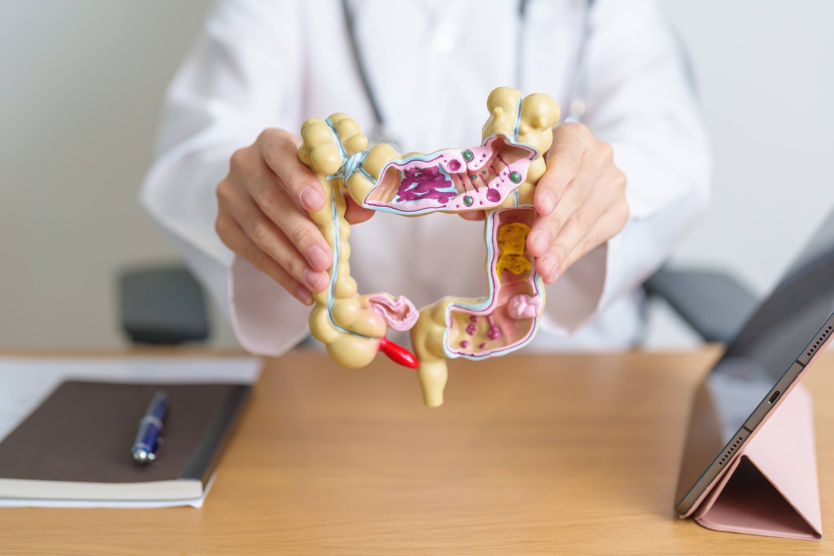 Doctor holding a plastic bowel.