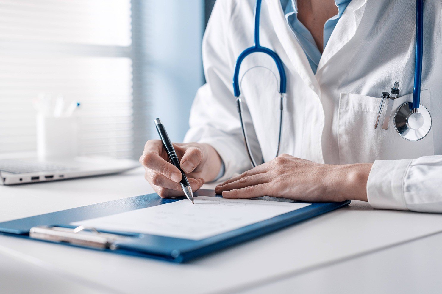 Doctor writing notes.